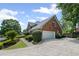 Brick home featuring an attached two car garage and well manicured landscaping at 530 Veranda Ct, Alpharetta, GA 30009