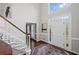 Elegant foyer with staircase featuring hardwood floors and natural light at 530 Veranda Ct, Alpharetta, GA 30009