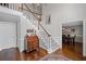 Grand foyer featuring hardwood floors, staircase, and traditional decor, offering an inviting entrance at 530 Veranda Ct, Alpharetta, GA 30009