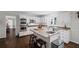 Charming kitchen with white cabinets, granite counters, and stainless steel appliances, offering a functional and stylish space at 530 Veranda Ct, Alpharetta, GA 30009