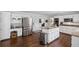 Modern kitchen with white cabinets, granite countertops, and stainless steel appliances, perfect for cooking and entertaining at 530 Veranda Ct, Alpharetta, GA 30009