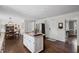 Open kitchen featuring granite countertops, stainless steel appliances, and dark wood flooring at 530 Veranda Ct, Alpharetta, GA 30009
