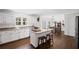 Well-appointed kitchen with white cabinetry, granite countertops, and stainless steel appliances, perfect for cooking at 530 Veranda Ct, Alpharetta, GA 30009