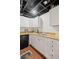 Kitchenette featuring a sink, cabinets, and a mini-fridge at 530 Veranda Ct, Alpharetta, GA 30009