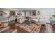 Spacious living room with hardwood floors, sectional sofa, and stylish accents, perfect for relaxation and entertaining at 530 Veranda Ct, Alpharetta, GA 30009