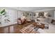 Comfortable living room with hardwood floors, French doors, and neutral decor, ideal for gatherings at 530 Veranda Ct, Alpharetta, GA 30009