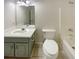 Bathroom featuring a vanity, toilet, and a tub with shower at 575 Freeman Dr, Covington, GA 30016