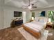 Bedroom with windows and a ceiling fan at 575 Freeman Dr, Covington, GA 30016