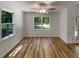 Bright dining room featuring large windows and hardwood floors at 575 Freeman Dr, Covington, GA 30016