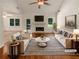 Bright living room featuring a fireplace, large windows and hardwood floors at 575 Freeman Dr, Covington, GA 30016