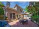 Exterior view of a backyard patio with grill, outdoor seating, and lush landscaping at 1255 Beech Haven Ne Rd, Atlanta, GA 30324