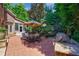 Backyard patio area with table, chairs, grill and view of greenery at 1255 Beech Haven Ne Rd, Atlanta, GA 30324