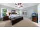 Bright bedroom featuring neutral walls, a ceiling fan, and a wooden bed frame at 1255 Beech Haven Ne Rd, Atlanta, GA 30324
