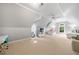 Bedroom with beds, a desk and a sofa under a sloped ceiling at 1255 Beech Haven Ne Rd, Atlanta, GA 30324