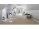 Bedroom showing two beds and seating area under sloped ceilings at 1255 Beech Haven Ne Rd, Atlanta, GA 30324