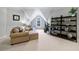 Bonus room area with neutral decor, a sitting area, and a tall built-in shelving unit at 1255 Beech Haven Ne Rd, Atlanta, GA 30324