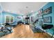 Bright home exercise room features wood floor and an array of workout equipment at 1255 Beech Haven Ne Rd, Atlanta, GA 30324