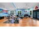 Brightly painted home gym features an array of work out equipment and hardwood floors at 1255 Beech Haven Ne Rd, Atlanta, GA 30324