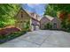 Charming brick home boasts a two-car garage, mature landscaping, and a beautifully paved driveway at 1255 Beech Haven Ne Rd, Atlanta, GA 30324