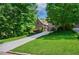 Beautiful brick home with manicured lawn, long driveway and mature trees at 1255 Beech Haven Ne Rd, Atlanta, GA 30324