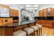 Gourmet kitchen featuring dark granite countertops, wood cabinets, a central island, and stainless appliances at 1255 Beech Haven Ne Rd, Atlanta, GA 30324