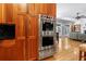 Kitchen showcases stainless steel appliances, custom cabinetry, and seamlessly connects to the living area at 1255 Beech Haven Ne Rd, Atlanta, GA 30324