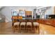 Kitchen island with breakfast bar seating, granite countertops, and custom cabinetry at 1255 Beech Haven Ne Rd, Atlanta, GA 30324