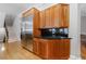 Kitchen with custom wood cabinetry, granite counters, and stainless steel refrigerator at 1255 Beech Haven Ne Rd, Atlanta, GA 30324