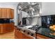 Close up of gourmet kitchen features a stainless steel range and hood, and granite countertops at 1255 Beech Haven Ne Rd, Atlanta, GA 30324