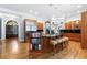 Open kitchen with stainless steel appliances, a large island with seating, and hardwood flooring at 1255 Beech Haven Ne Rd, Atlanta, GA 30324