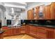 Close-up of gourmet kitchen featuring stainless steel appliances, custom cabinets and black countertops at 1255 Beech Haven Ne Rd, Atlanta, GA 30324