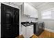 Laundry room features a sink, washing machine and dryer, and hardwood floors at 1255 Beech Haven Ne Rd, Atlanta, GA 30324