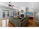 Spacious living room with a fireplace, hardwood floors, large windows, and comfortable seating at 1255 Beech Haven Ne Rd, Atlanta, GA 30324