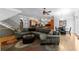 Open concept living room with hardwood floors, fireplace, kitchen and dining areas at 1255 Beech Haven Ne Rd, Atlanta, GA 30324