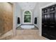 Well-appointed bathroom with a soaking tub, a large arched window, and a separate glass-enclosed shower at 1255 Beech Haven Ne Rd, Atlanta, GA 30324