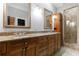 A bathroom with double sinks, granite countertops, custom cabinets, and a walk-in glass enclosed shower at 1255 Beech Haven Ne Rd, Atlanta, GA 30324
