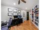 Spacious home office featuring built-in bookshelves, desk, and hardwood floors at 1255 Beech Haven Ne Rd, Atlanta, GA 30324