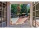 A lovely patio featuring brick pavers, an outdoor table and chairs, and wrought iron railings at 1255 Beech Haven Ne Rd, Atlanta, GA 30324