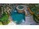 Aerial view of a tranquil pool and spa area, surrounded by lush greenery and stone accents at 1255 Beech Haven Ne Rd, Atlanta, GA 30324