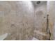 A large custom shower with a built-in bench and two shower heads surrounded by light stone tile at 1255 Beech Haven Ne Rd, Atlanta, GA 30324