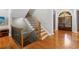 Elegant staircase with hardwood steps and black iron railing at 1255 Beech Haven Ne Rd, Atlanta, GA 30324