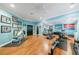 Bright workout room with hardwood floors, lots of equipment, and Ironman decorations at 1255 Beech Haven Ne Rd, Atlanta, GA 30324