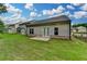 Spacious backyard boasts level lawn area and home's gray siding at 2505 Whistler Way Ne, Lawrenceville, GA 30043