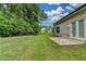 Spacious backyard boasts level lawn area and home's gray siding at 2505 Whistler Way Ne, Lawrenceville, GA 30043