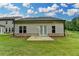 Spacious backyard boasts level lawn area and home's gray siding at 2505 Whistler Way Ne, Lawrenceville, GA 30043