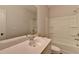 Bright bathroom featuring a shower-tub combo, single vanity, and large mirror at 2505 Whistler Way Ne, Lawrenceville, GA 30043