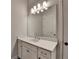 Bathroom vanity with a large mirror and ample lighting at 2505 Whistler Way Ne, Lawrenceville, GA 30043