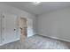 Bedroom featuring neutral carpet and two white doors leading to other rooms at 2505 Whistler Way Ne, Lawrenceville, GA 30043