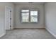 Neutral bedroom features a window that provides natural light at 2505 Whistler Way Ne, Lawrenceville, GA 30043