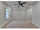 Bright bonus room offers neutral paint, carpet, ceiling fan, and natural light at 2505 Whistler Way Ne, Lawrenceville, GA 30043